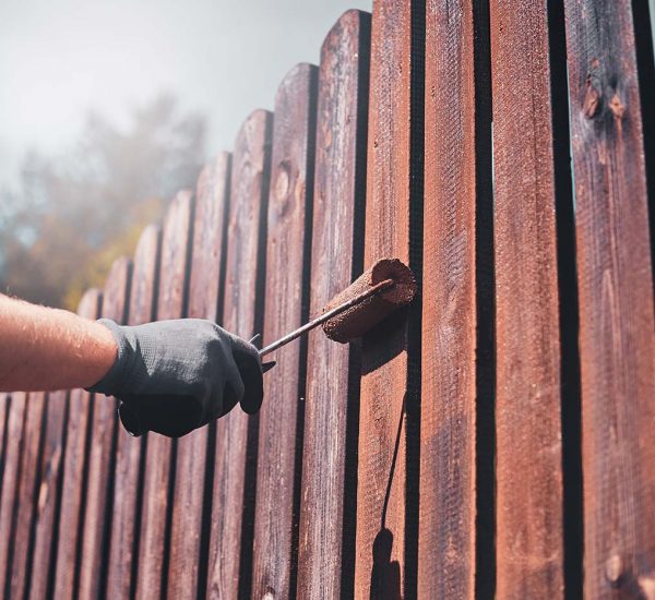 diligent-man-is-painting-fence-with-brush-2021-08-28-11-14-27-utc